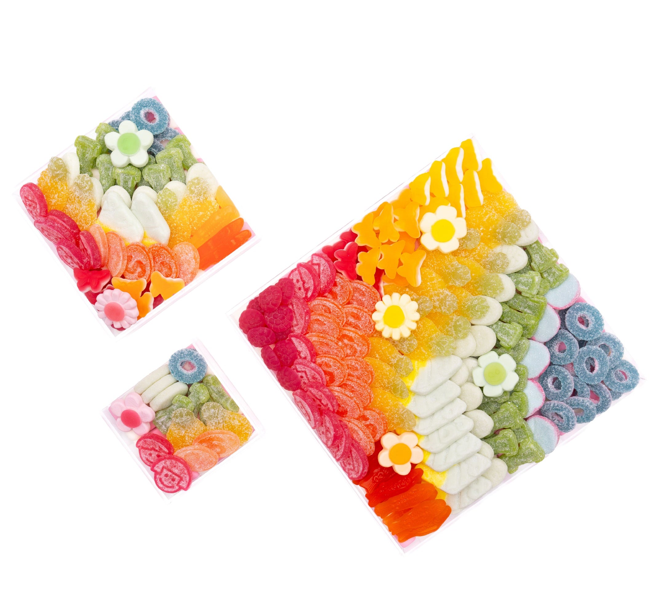 The Crowd Pleaser candy board by Candy Goddess — assorted rainbow gummies arranged on a reusable acrylic board
