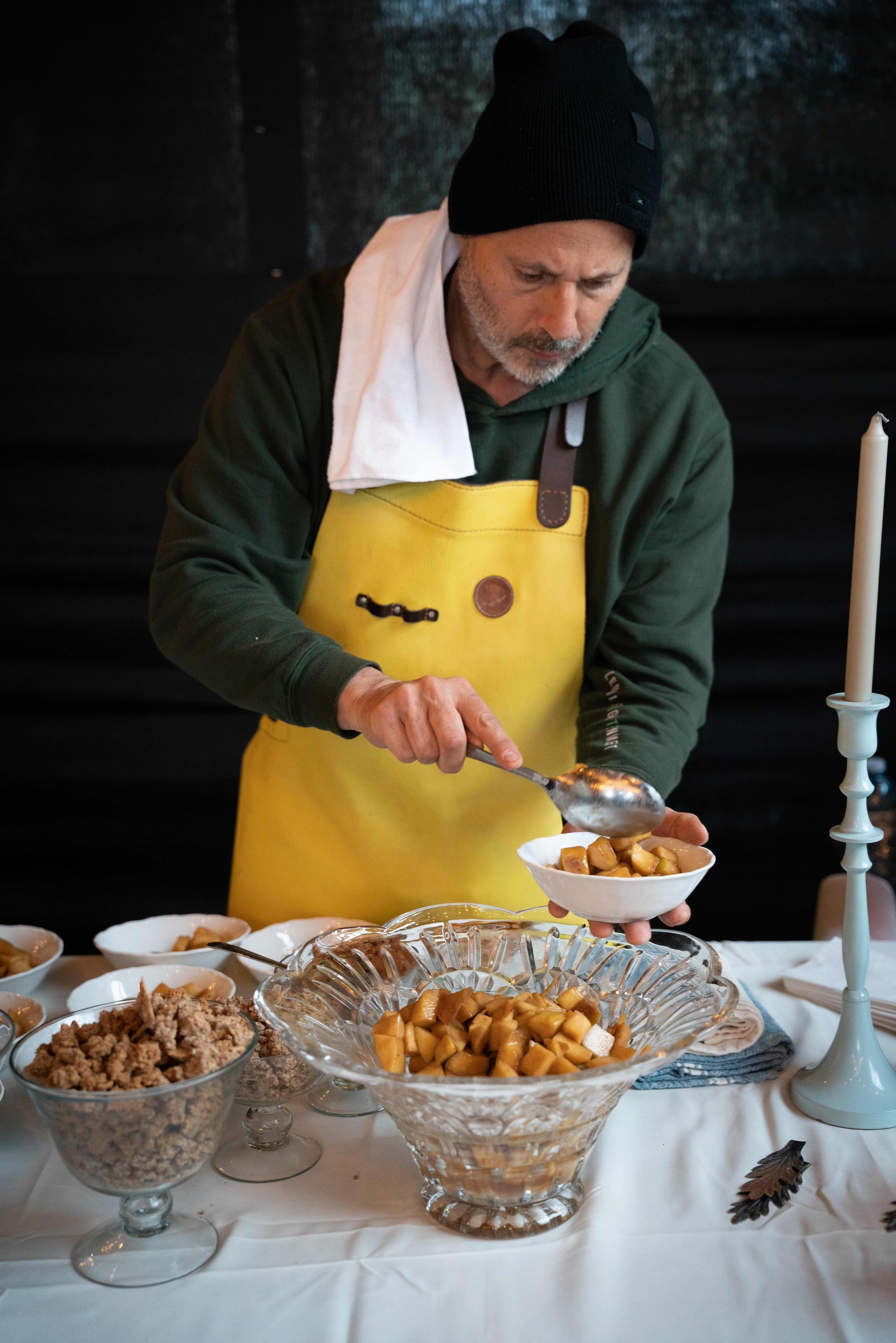 Chef serving baked dishes at an In Autumn tasting table
