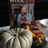 Cookbook displayed beside heirloom squash at In Autumn